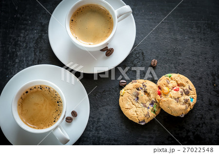 Two cups of coffee with  cookies 27022548