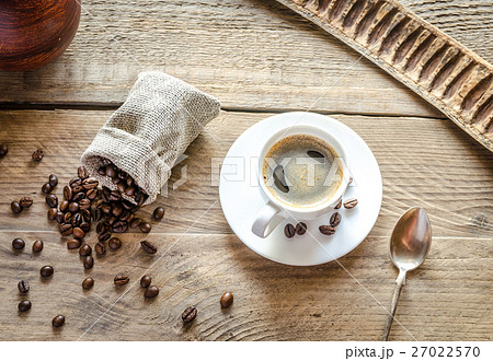 Cup of coffee with coffee beans Cup of coffee with coffee beans 27022570