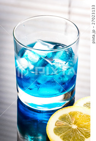 Glass of blue curacao cocktail 27023133