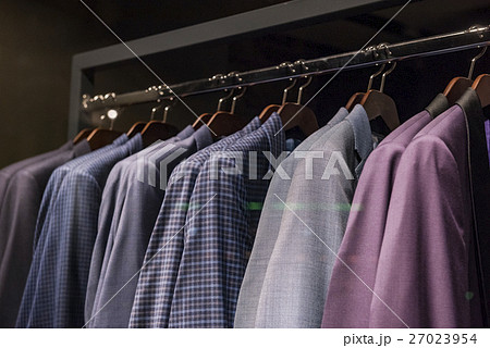 Elegant suits in a men clothing shop. Elegant suits in a men clothing shop. 27023954
