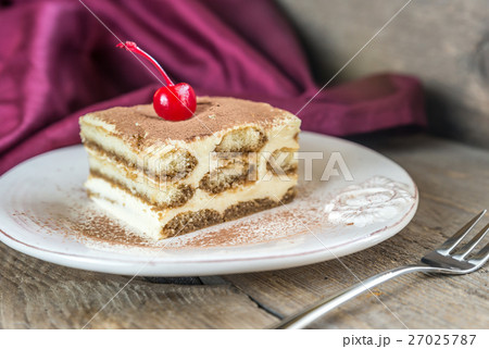 Tiramisu in the plate on the wooden background 27025787