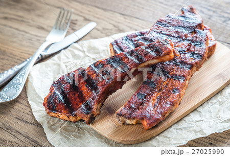 Grilled pork ribs on the baking paper Grilled pork ribs on the baking paper 27025990