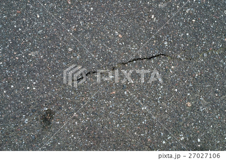 cracked gray asphalt background cracked gray asphalt background 27027106