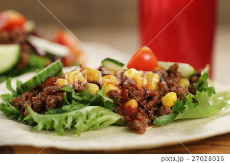 homemade open tortilla sandwich with beef, frisee, beans and corn homemade open tortilla sandwich with beef, frisee, beans and corn 27028016