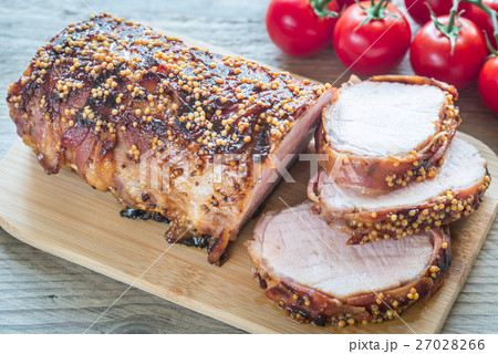 Baked pork meat wrapped in bacon 27028266