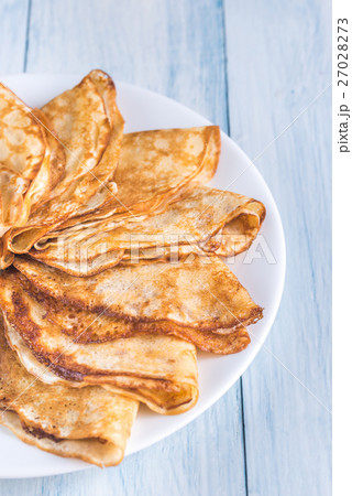 Pile of crepes on the plate 27028273