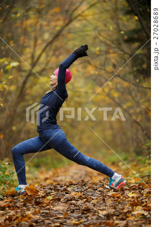 Young woman on stretching exercises Young woman on stretching exercises 27028689