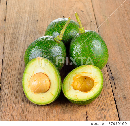 Avocado on wooden  background. 27030169
