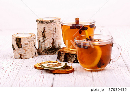 two cups of black tea,dried lemons lying two cups of black tea,dried lemons lying 27030456