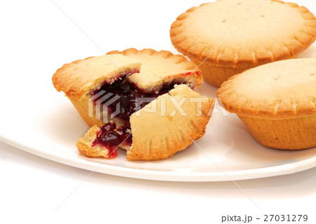 Tasty buns with berries on a white plate 27031279