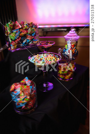 Swets and candies served in glass bowls Swets and candies served in glass bowls 27031538