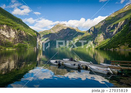 Summer morning sun at Geiranger fjord, Norway Summer morning sun at Geiranger fjord, Norway 27035819