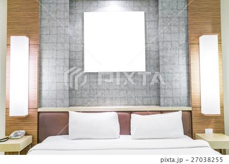 Comfortable pillows and bed . 27038255