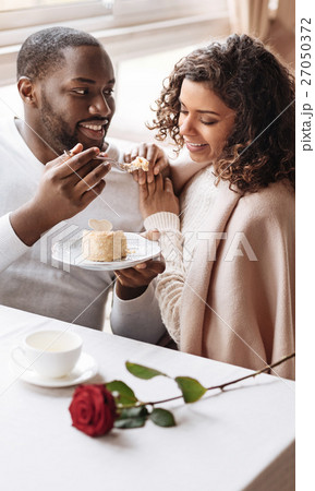 Smiling African American couple enjoying the date Smiling African American couple enjoying the date 27050372