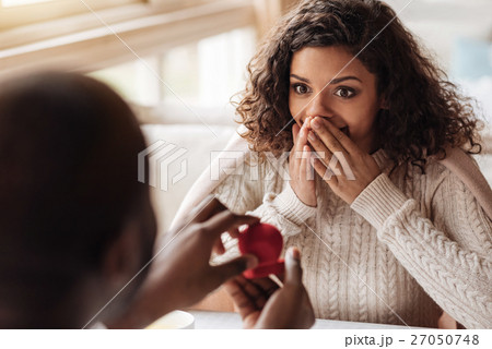 Shocked African American woman getting the 27050748
