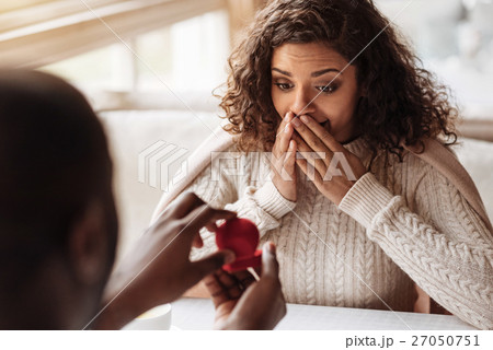 Amazed African American woman receiving the 27050751
