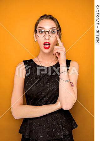Portrait of young woman with shocked facial 27052175
