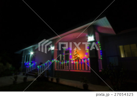 blurred house decorated with lights for Christmas 27054325
