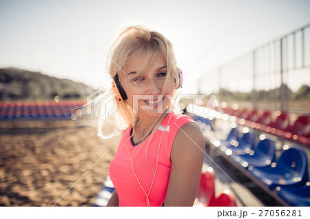 Smiling beach volleyball female player portrait Smiling beach volleyball female player portrait 27056281