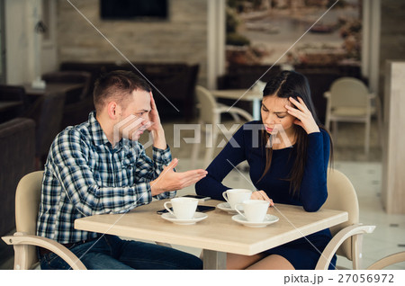 Young couple arguing in a cafe. She's had enough Young couple arguing in a cafe. She's had enough 27056972