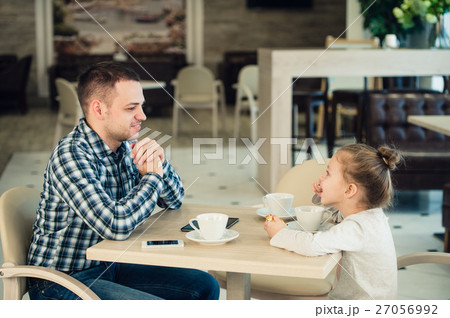 Father And Daughter Having Lunch Together At The 27056992
