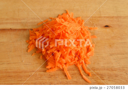 Drated carrots on wooden. Drated carrots on wooden. 27058033