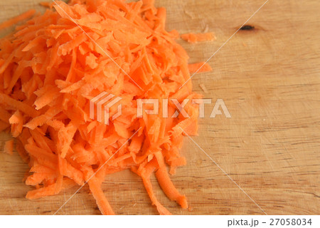 Drated carrots on wooden. 27058034