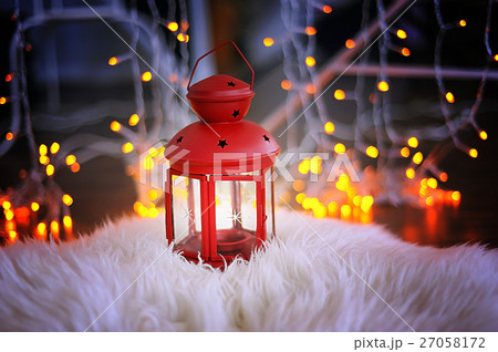 Red candle holder with a stands on white skin Red candle holder with a stands on white skin 27058172