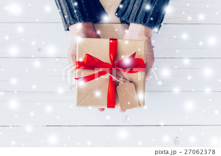 Close up hand woman holding and person gift box 27062378