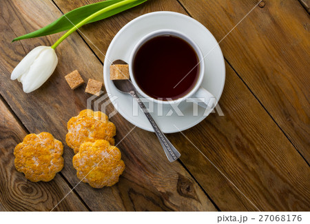 Cup of tea and crumbly homemade cookies top view Cup of tea and crumbly homemade cookies top view 27068176