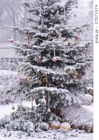 Decorated Christmas Tree at snow winter weather 27071974