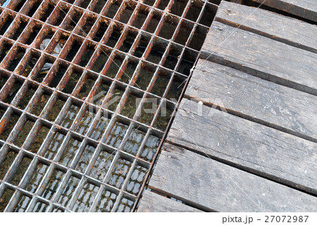 Sewer rusty steel and wood cover water drainage 27072987