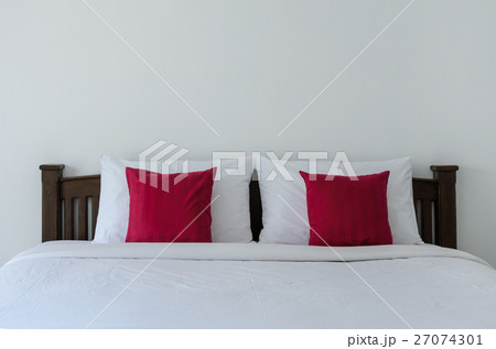 White bedroom with tidy white bed 27074301