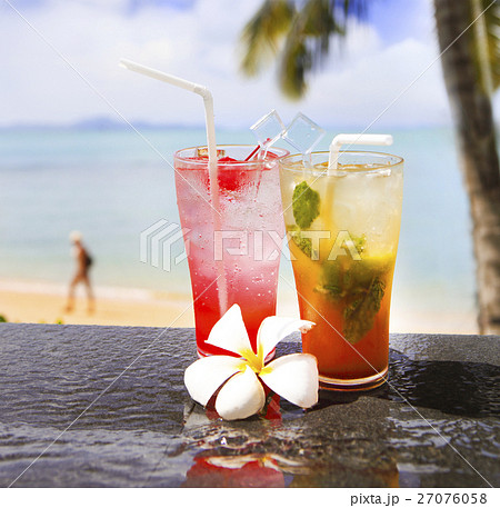 Two exotic cocktails in a tropical setting Two exotic cocktails in a tropical setting 27076058