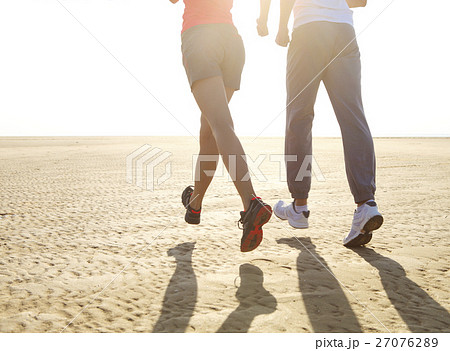 Couple jogging outside. Close up Couple jogging outside. Close up 27076289