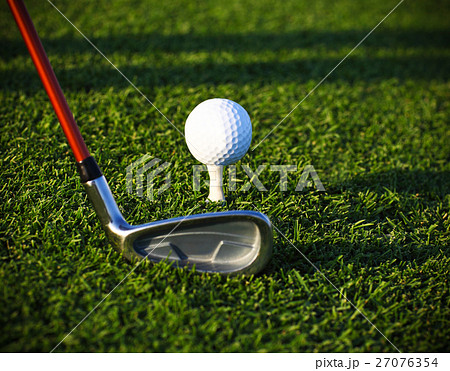 Golf ball on tee and driver 27076354