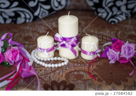 Wedding decoration, candles with purple ribbon 27084582