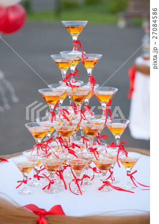 Pyramid of holiday wineglasses with wine or Pyramid of holiday wineglasses with wine or 27084586