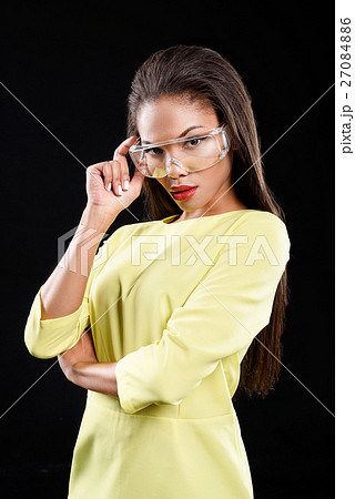 Concentrated model is standing in confident pose Concentrated model is standing in confident pose 27084886