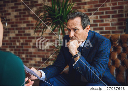 Attentive mature man in office of psychologist 27087648