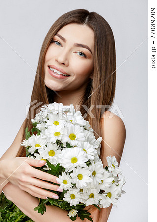 Beautiful Woman with Clean Fresh Skin holding Beautiful Woman with Clean Fresh Skin holding 27089209