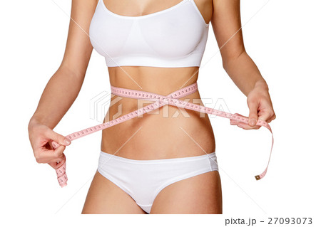 Torso of woman in white bikini sunbathing 27093073