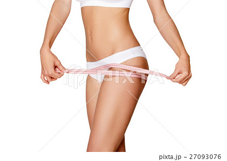 Torso of woman in white bikini sunbathing 27093076
