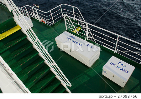 boxes with life jackets on deck of cruise ship 27093766