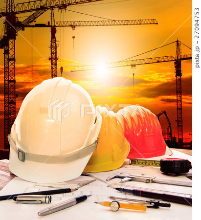 safety helmet on engineer working table and constr 27094753