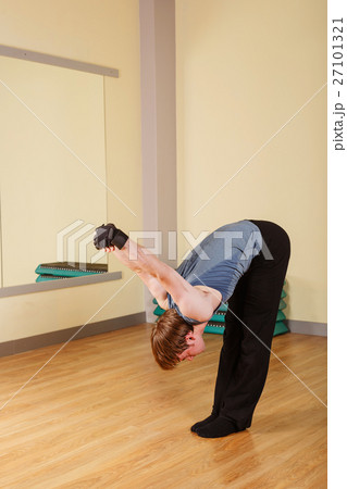 Man stretching the shoulder joint Man stretching the shoulder joint 27101321