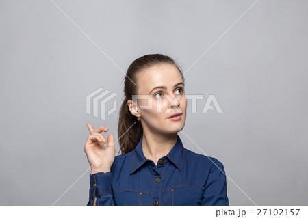 Portrait of young woman with idea Portrait of young woman with idea 27102157