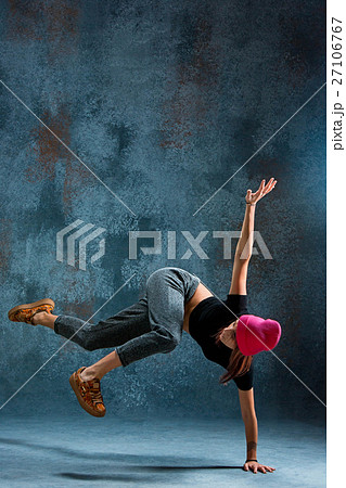 Young girl break dancing on wall background. Young girl break dancing on wall background. 27106767