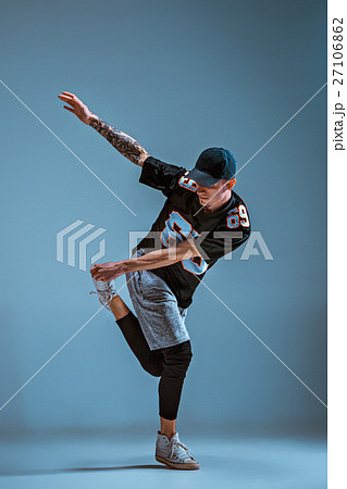 Young Man Break Dancing On Wall Background の写真素材
