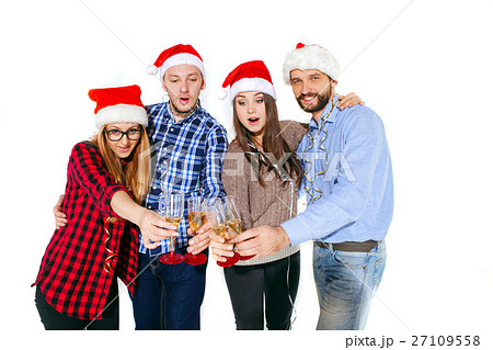 Many young women and men drinking at christmas Many young women and men drinking at christmas 27109558